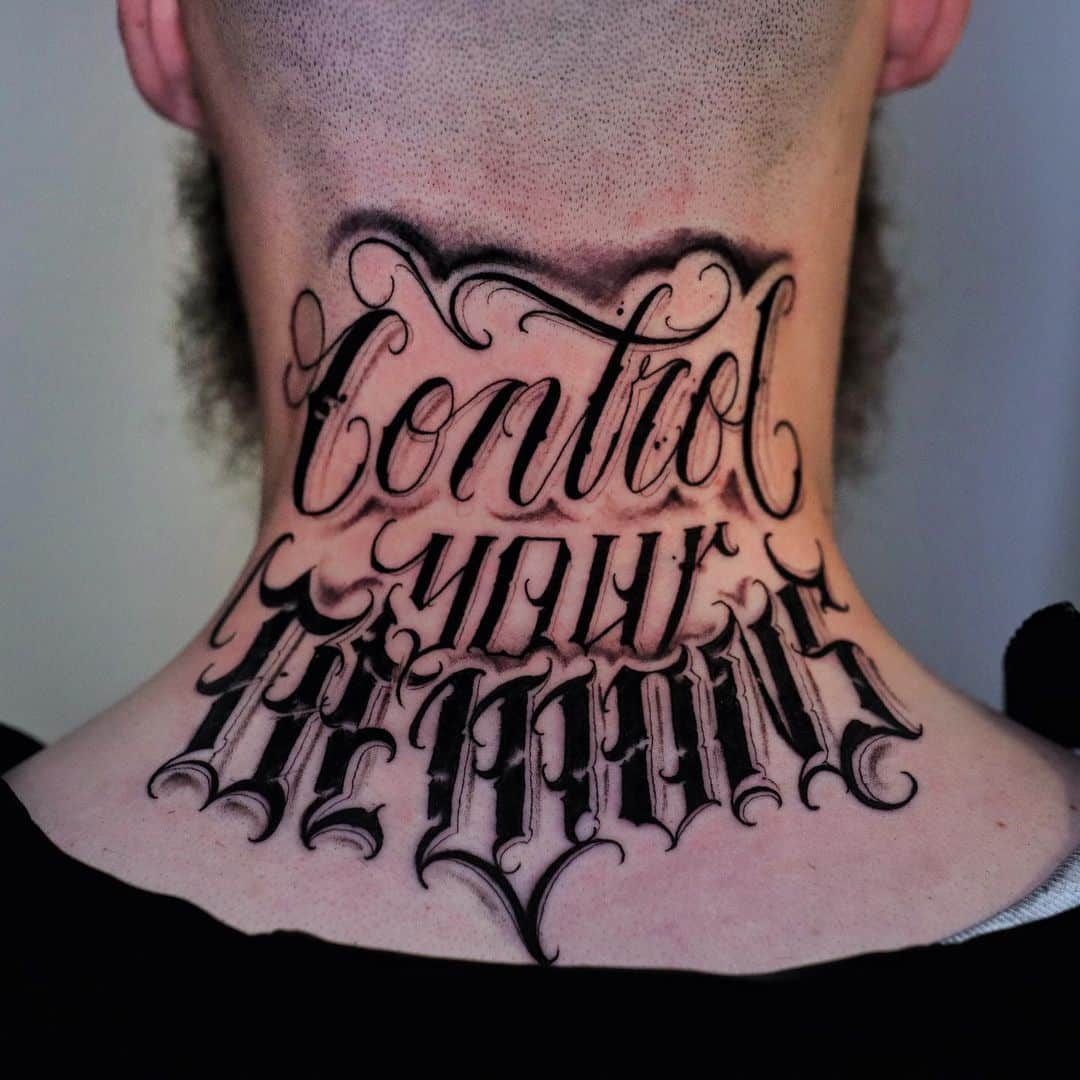 Artful neck tattoo with the text 'Control your Demons' in Gothic style.