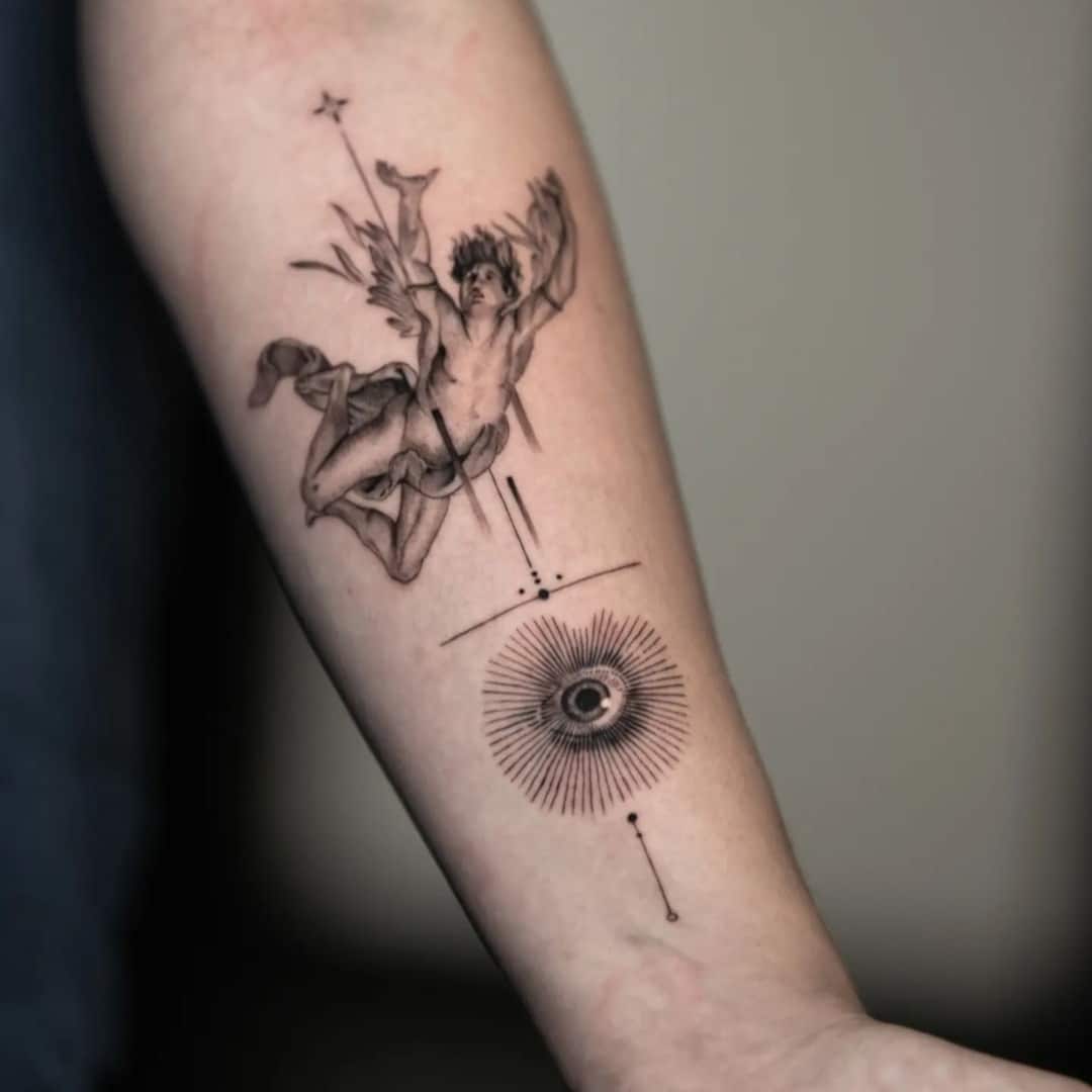 Tattoo of a winged figure with geometric symbols on forearm