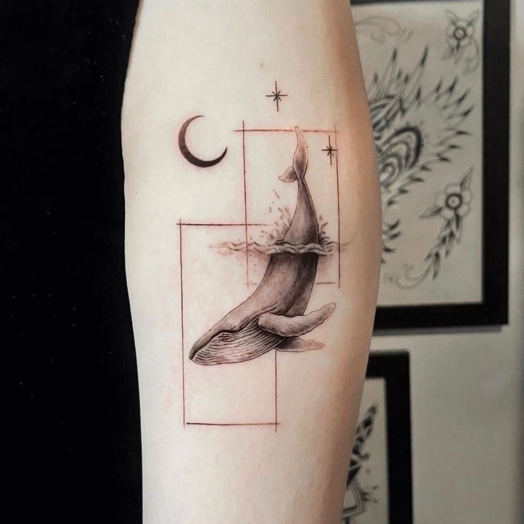 Whale tattoo design with celestial elements.