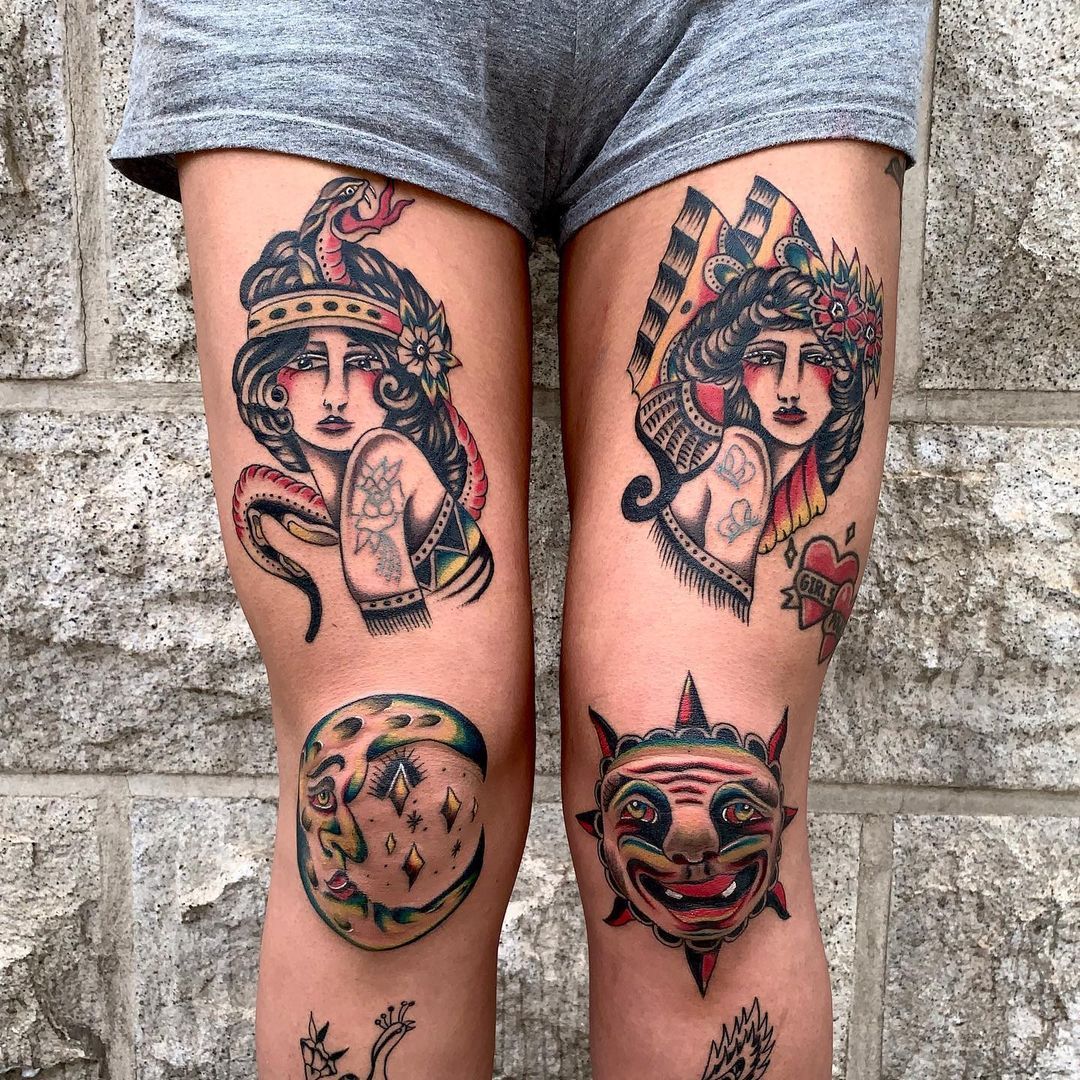Detailed tattoo artwork on legs featuring sun, moon, and female figures.