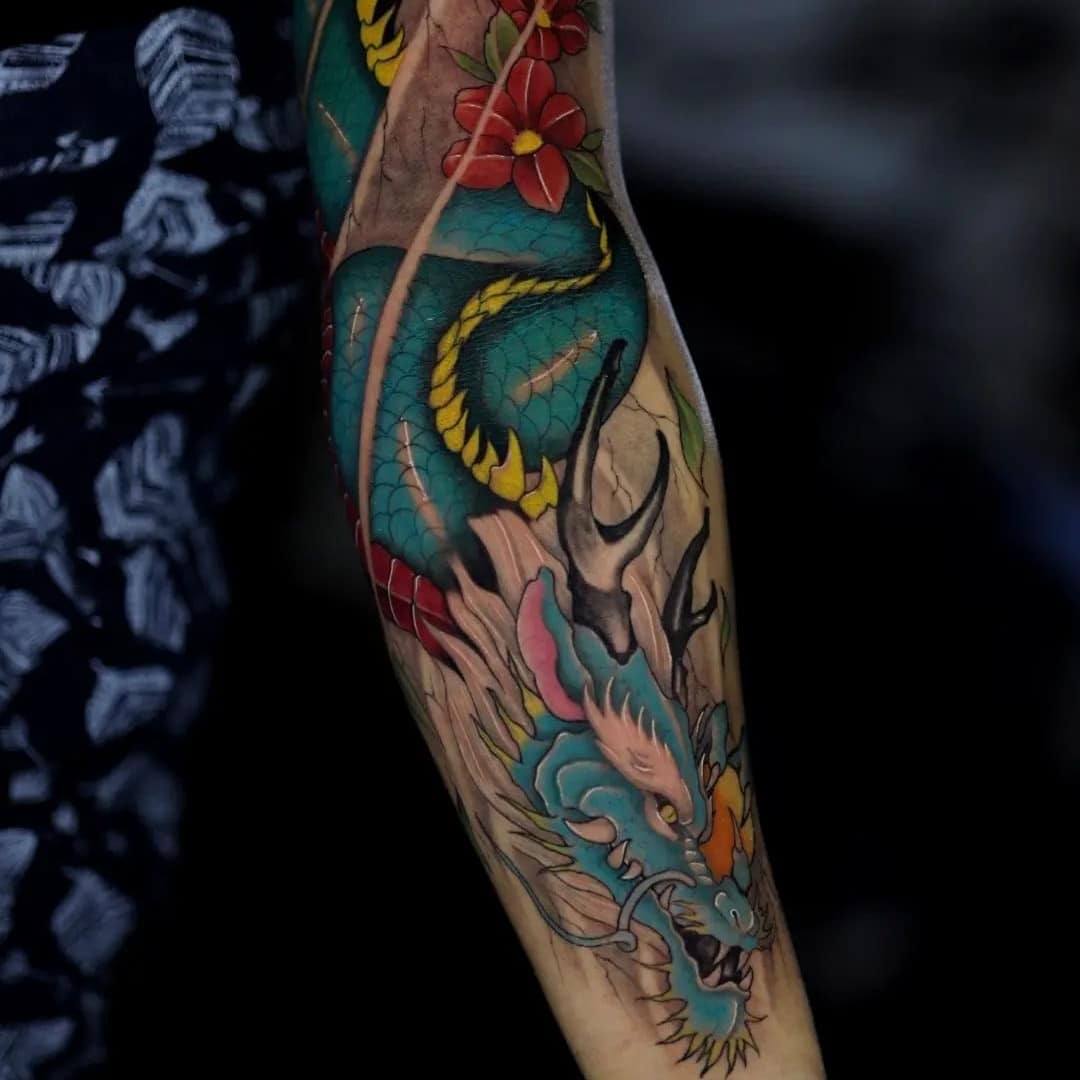 Colorful dragon tattoo on a person's arm