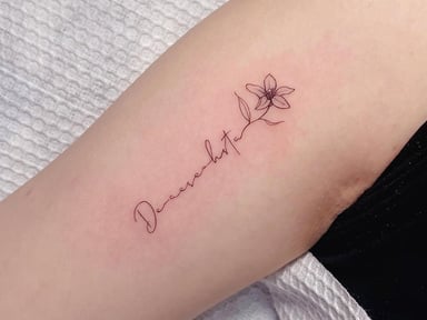 Minimalist floral tattoo design on skin